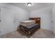 Simple bedroom with tiled floors, white walls, and minimalistic decor at 7720 W Agate Ave, Las Vegas, NV 89113