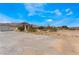 Wide driveway of a single story home, desert landscaping at 7720 W Agate Ave, Las Vegas, NV 89113