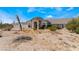 Charming single-story home with a desert landscape, tile roof, and inviting entryway, perfect for relaxation at 7720 W Agate Ave, Las Vegas, NV 89113