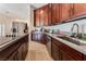 Updated kitchen features sleek countertops and stainless steel appliances at 7720 W Agate Ave, Las Vegas, NV 89113
