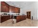 Spacious kitchen features wooden cabinets and a center island at 7720 W Agate Ave, Las Vegas, NV 89113