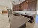 Well-appointed kitchen featuring an island and updated appliances at 7720 W Agate Ave, Las Vegas, NV 89113