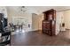 A living room features wood flooring, an ornate armoire, and a bay window at 7720 W Agate Ave, Las Vegas, NV 89113