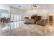 Large and inviting living area with tiled flooring and direct access to the outdoor area at 7720 W Agate Ave, Las Vegas, NV 89113