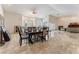 Bright and open living room with tile floors, windows, and a fireplace at 7720 W Agate Ave, Las Vegas, NV 89113
