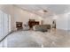 Bright and airy living room featuring a fireplace, vaulted ceilings, and double french doors at 7720 W Agate Ave, Las Vegas, NV 89113