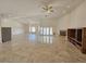 Spacious living area with tile floors, fireplace, and modern lighting at 7720 W Agate Ave, Las Vegas, NV 89113