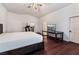 Bedroom with hardwood floors and access to living room area at 7720 W Agate Ave, Las Vegas, NV 89113