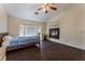 Spacious main bedroom featuring hardwood floors, vaulted ceiling, a fireplace and lots of natural light at 7720 W Agate Ave, Las Vegas, NV 89113
