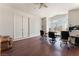 Large office room with big windows, hardwood floors, and plenty of space for working at 7720 W Agate Ave, Las Vegas, NV 89113