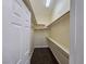 This walk-in closet offers ample shelving and storage space, with a durable floor at 7720 W Agate Ave, Las Vegas, NV 89113