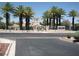 Community clubhouse with well-maintained landscaping, signage, and mature trees at 7955 Canto Ave, Las Vegas, NV 89147