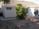 Charming front yard featuring a well-maintained desert rock landscape, patio, and tiled roof at 7955 Canto Ave, Las Vegas, NV 89147