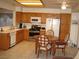 Open kitchen with dining area, appliances and plenty of storage space, perfect for everyday meals and gatherings at 7955 Canto Ave, Las Vegas, NV 89147
