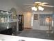 Inviting living room featuring vaulted ceilings, a fireplace, and a display case for showcasing cherished collectibles at 7955 Canto Ave, Las Vegas, NV 89147