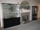 Comfortable living room with fireplace, display cases, and tasteful decor, enhancing the home's charm and character at 7955 Canto Ave, Las Vegas, NV 89147