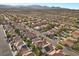 Picturesque aerial shot showcasing a charming residential neighborhood with well-maintained homes and scenic surroundings at 8083 Shadowvale Dr, Las Vegas, NV 89147
