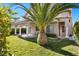 Inviting backyard with lush lawn, mature landscaping, and a covered patio area perfect for outdoor entertaining at 8083 Shadowvale Dr, Las Vegas, NV 89147