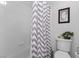 Full bathroom featuring a shower and tub combo with stylish shower curtain, neutral walls, and decor at 8083 Shadowvale Dr, Las Vegas, NV 89147