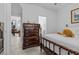 Bright bedroom featuring wood accents, plenty of closet space, and doorway to bath at 8083 Shadowvale Dr, Las Vegas, NV 89147