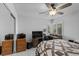 Cozy bedroom features a ceiling fan, carpeted floors, and a comfortable bed at 8083 Shadowvale Dr, Las Vegas, NV 89147