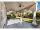 Spacious covered patio with elegant columns and ceiling fan, ideal for outdoor relaxation and entertaining at 8083 Shadowvale Dr, Las Vegas, NV 89147