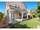 Charming covered patio with classic arched columns and access to the manicured backyard, a great space at 8083 Shadowvale Dr, Las Vegas, NV 89147