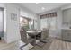 Charming dining area with backyard view, offering a seamless transition to outdoor living at 8083 Shadowvale Dr, Las Vegas, NV 89147