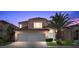 Charming two-story home boasts a three car garage, red tile roof, and lush landscaping at 8083 Shadowvale Dr, Las Vegas, NV 89147