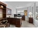 Spacious home office featuring wood furnishings, large desk, and natural light at 8083 Shadowvale Dr, Las Vegas, NV 89147