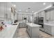 Spacious kitchen featuring an island and stylish backsplash, perfect for cooking and entertaining at 8083 Shadowvale Dr, Las Vegas, NV 89147