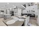 Open-concept kitchen and dining area with modern appliances and seamless access to the living room at 8083 Shadowvale Dr, Las Vegas, NV 89147