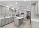 A kitchen featuring gray cabinets, granite countertops, stainless steel appliances, and wood-style flooring at 8083 Shadowvale Dr, Las Vegas, NV 89147