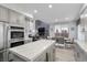 Modern kitchen with stainless steel appliances, light cabinets, and a large island perfect for gatherings at 8083 Shadowvale Dr, Las Vegas, NV 89147