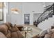 Bright living room with high ceilings, transom windows, plush seating, and modern decor at 8083 Shadowvale Dr, Las Vegas, NV 89147