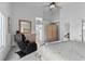 Relaxing primary bedroom suite with good natural lighting, seating and an ensuite bathroom at 8083 Shadowvale Dr, Las Vegas, NV 89147