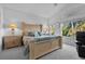 Spacious main bedroom with natural lighting, carpeted floors, and modern furniture at 8083 Shadowvale Dr, Las Vegas, NV 89147