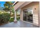 Covered patio with neutral colors, pillar accents, and sliding door to the home's interior at 8083 Shadowvale Dr, Las Vegas, NV 89147