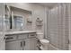 Bathroom featuring toilet, sink and shower with a striped curtain at 8254 Palladium St, Las Vegas, NV 89113