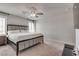 Cozy bedroom with a queen bed, carpet, and window with stylish white shutters at 8254 Palladium St, Las Vegas, NV 89113