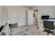 This bedroom boasts carpeted floors, a closet, and a desk next to a couch at 8254 Palladium St, Las Vegas, NV 89113