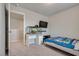 Bedroom featuring desk, aquarium, carpet, tv and window in neutral tones at 8254 Palladium St, Las Vegas, NV 89113