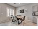 Dining room features a modern table and chairs, natural light, and stylish decor at 8254 Palladium St, Las Vegas, NV 89113