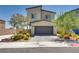 Charming two-story home featuring a well-maintained front yard and a two-car garage at 8254 Palladium St, Las Vegas, NV 89113