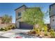 Contemporary two-story home with a two-car garage and xeriscaped landscaping at 8254 Palladium St, Las Vegas, NV 89113