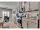 Stylish kitchen boasts stainless steel appliances, granite countertops, and ample cabinet space at 8254 Palladium St, Las Vegas, NV 89113
