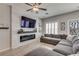 Living room showcasing a stone accent wall, modern fireplace, and an oversized sectional sofa at 8254 Palladium St, Las Vegas, NV 89113