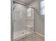 Modern shower with white subway tile surround, clear glass door and seating at 8254 Palladium St, Las Vegas, NV 89113