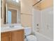 Bathroom featuring a tub-shower combo, vanity with a white countertop, and modern fixtures at 8448 Quarentina Ave, Las Vegas, NV 89149