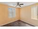 Bright bedroom with two windows providing natural light and neutral color palette at 8448 Quarentina Ave, Las Vegas, NV 89149